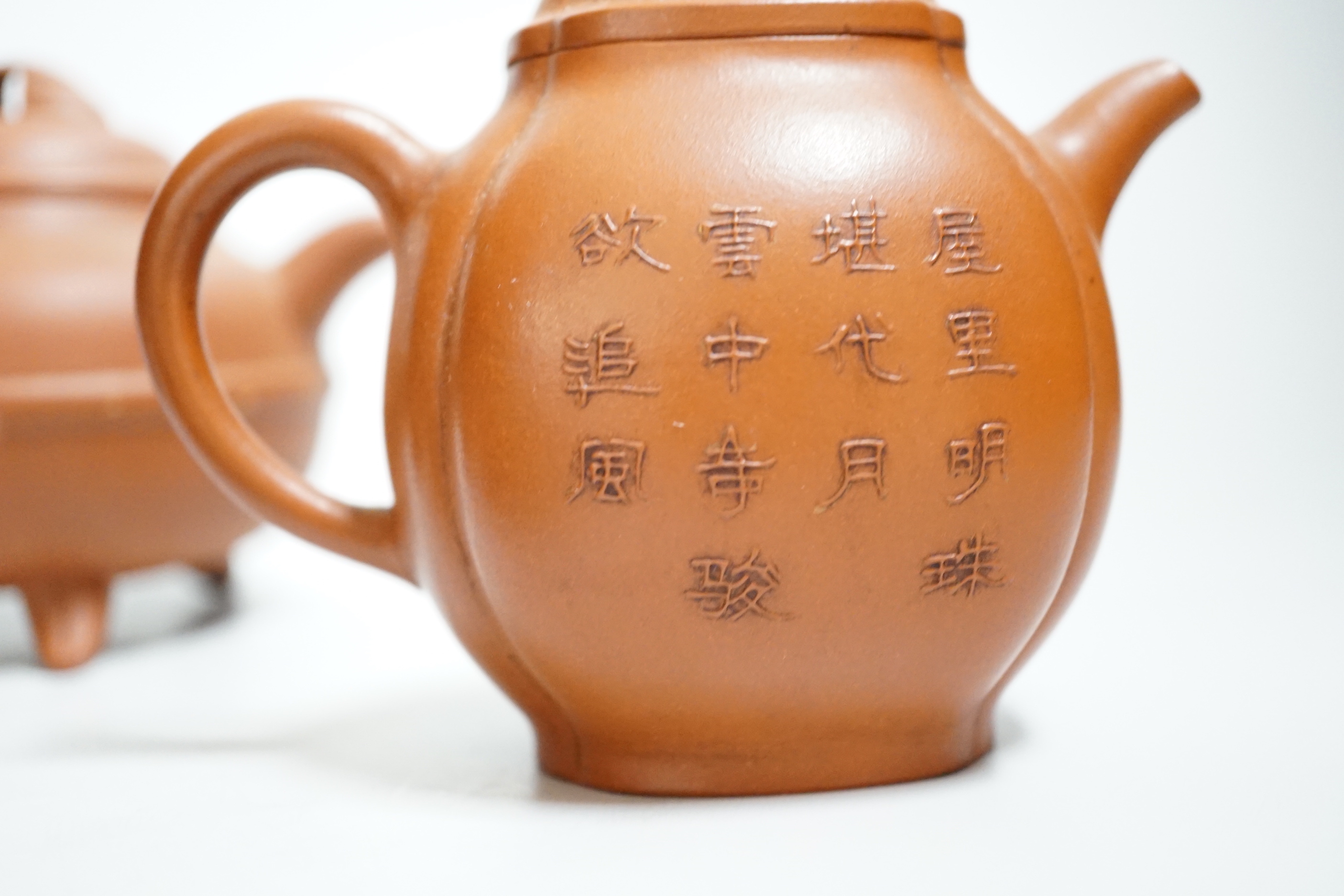 Four Chinese Yixing teapots, one slip decorated with a landscape